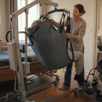 Lève personnes à domicile pour transfert sécurisé, hamac entre lit et fauteuil